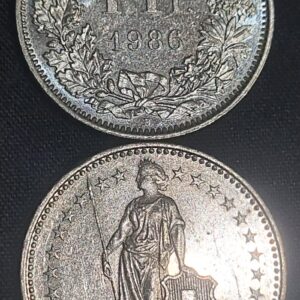 Moeda Suíça – Km024a.3 – 1 Franco – 1986 – Cuproniquel – 4,40 Gr – 23,20 mm – Excelente Peça